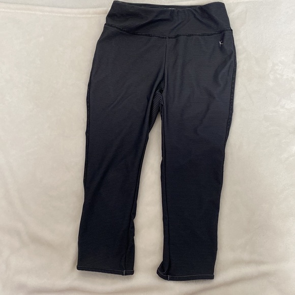 Dansko black and grey striped leggings. Cute detail of tear drop cutouts on legs - Picture 6 of 6